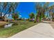 Picturesque community park with lush greenery, a pond, and walking paths, perfect for outdoor activities at 16284 W Desert Mirage Dr, Surprise, AZ 85379