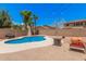 Inviting backyard pool with poolside furniture, perfect for relaxation and outdoor fun at 16284 W Desert Mirage Dr, Surprise, AZ 85379