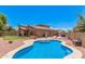 Stunning backyard with a sparkling pool and ample seating, creating a private oasis at 16284 W Desert Mirage Dr, Surprise, AZ 85379
