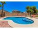 Lovely pool with a unique design and ample space for lounging and entertaining outdoors at 16284 W Desert Mirage Dr, Surprise, AZ 85379