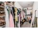 Spacious walk-in closet offering ample storage with shelving and hanging space for organized living at 16284 W Desert Mirage Dr, Surprise, AZ 85379
