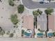 An aerial view showing a house with a pool, landscaping, and other houses in a well-planned community at 16404 S 18Th Dr, Phoenix, AZ 85045