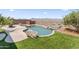 Scenic backyard showcasing a beautiful pool with rock accents and an expansive mountain view for outdoor enjoyment at 16404 S 18Th Dr, Phoenix, AZ 85045
