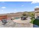 Expansive backyard featuring a pool, spa, and patio area with stunning mountain views for outdoor relaxation at 16404 S 18Th Dr, Phoenix, AZ 85045