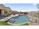 Inviting backyard with pool, spa, patio, and mountain views creating a relaxing outdoor retreat at 16404 S 18Th Dr, Phoenix, AZ 85045