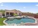 Backyard features an inviting pool, covered patio, lush turf, and a BBQ area for enjoyable outdoor living at 16404 S 18Th Dr, Phoenix, AZ 85045