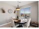 Bright dining area features a round table with seating for four and natural light at 16404 S 18Th Dr, Phoenix, AZ 85045