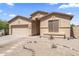 Charming single-story home with a well-maintained desert landscape, complemented by a two-car garage at 16404 S 18Th Dr, Phoenix, AZ 85045
