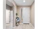Light and bright foyer with a white front door, console table, and tiled flooring at 16404 S 18Th Dr, Phoenix, AZ 85045