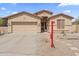 Front exterior showcasing desert landscaping and a sign at 16404 S 18Th Dr, Phoenix, AZ 85045