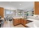 Open kitchen and dining area with stainless steel appliances and natural lighting at 16404 S 18Th Dr, Phoenix, AZ 85045