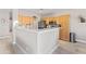 Kitchen with wooden cabinets, stone countertops, breakfast bar, and stainless steel appliances at 16404 S 18Th Dr, Phoenix, AZ 85045