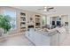 Bright living room featuring a cozy fireplace, built-in shelving, and a great view to the kitchen at 16404 S 18Th Dr, Phoenix, AZ 85045