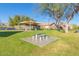 Community recreation area featuring picnic tables, playground, green space, and desert landscaping at 16404 S 18Th Dr, Phoenix, AZ 85045