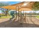 Community playground featuring slides, climbing structures, and shade canopies for outdoor activities at 16404 S 18Th Dr, Phoenix, AZ 85045