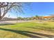 Grassy community recreation area featuring playground, basketball court, sand volleyball court, tennis court, and picnic area at 16404 S 18Th Dr, Phoenix, AZ 85045