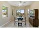Bright breakfast nook with tile flooring, table, and backyard views at 16716 W Rincon Peak Dr, Surprise, AZ 85387