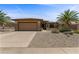Charming single-story home featuring a desert landscape, two-car garage and a neutral color palette at 16716 W Rincon Peak Dr, Surprise, AZ 85387