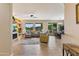 Spacious living room with tile floors, fireplace, and backyard access at 16716 W Rincon Peak Dr, Surprise, AZ 85387