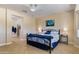 Cozy main bedroom featuring a ceiling fan and decorative bedding at 16716 W Rincon Peak Dr, Surprise, AZ 85387