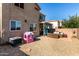 Well maintained backyard featuring patio area, seating, and desert landscaping at 17413 W Mandalay Ln, Surprise, AZ 85388