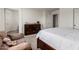 Bedroom with a large bed, tiled floors and view of the bonus seating area at 17413 W Mandalay Ln, Surprise, AZ 85388