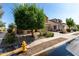 Two-story home featuring a tile roof, a two-car garage, and a beautifully landscaped front yard at 17413 W Mandalay Ln, Surprise, AZ 85388