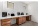 Home office with expansive desk space, built-in cabinets, and natural light from the windows at 17413 W Mandalay Ln, Surprise, AZ 85388