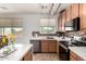 Kitchen showcasing stone countertops, decorative tile backsplash, and stainless steel appliances at 17413 W Mandalay Ln, Surprise, AZ 85388