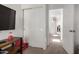 Living room area showcasing closet doors, hall entry, neutral walls and carpet at 17413 W Mandalay Ln, Surprise, AZ 85388