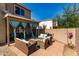 Covered patio with comfortable seating for outdoor enjoyment and relaxation at 17413 W Mandalay Ln, Surprise, AZ 85388