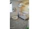Bedroom featuring white crib, ball pit, and neutral colors at 18230 W Poston Dr, Surprise, AZ 85387