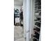 Organized walk-in closet with shelving and clothing racks provides ample storage space at 18230 W Poston Dr, Surprise, AZ 85387