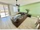 Modern living room with large sectional couch and sliding doors at 18230 W Poston Dr, Surprise, AZ 85387