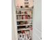 Walk-in pantry providing plenty of room for storing food items at 18230 W Poston Dr, Surprise, AZ 85387