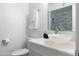 Well-lit bathroom with a vessel sink, chrome fixtures, and contemporary decor at 1894 E Julie Dr, Tempe, AZ 85283