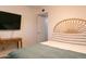 Bright bedroom with TV and side table at 1894 E Julie Dr, Tempe, AZ 85283