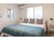 Bright bedroom with a queen size bed, overhead lighting, and bright windows at 1894 E Julie Dr, Tempe, AZ 85283