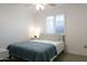 Well lit bedroom with queen size bed, white nightstand, and large window with shutter blinds at 1894 E Julie Dr, Tempe, AZ 85283