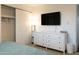 Bedroom with TV and dresser, sliding closet door and overhead lighting at 1894 E Julie Dr, Tempe, AZ 85283