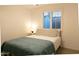 Bedroom with queen size bed, white nightstand, and large window with shutter blinds at 1894 E Julie Dr, Tempe, AZ 85283
