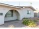 Welcoming front entrance featuring an arched doorway, brick-paved walkway, and beautiful desert landscaping at 1894 E Julie Dr, Tempe, AZ 85283