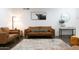 Cozy living room featuring hardwood floors, comfortable seating, and a stylish, modern design at 1894 E Julie Dr, Tempe, AZ 85283