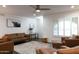 Comfortable living room featuring hardwood floors, neutral walls, and ample natural light from large windows at 1894 E Julie Dr, Tempe, AZ 85283
