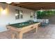 Covered patio with a pool table, a ceiling fan, and an outdoor lounge area at 1894 E Julie Dr, Tempe, AZ 85283
