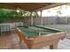 Covered patio featuring a pool table, an outdoor seating area, and tiled flooring at 1894 E Julie Dr, Tempe, AZ 85283