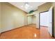 Bedroom with stained concrete floors and sliding mirror closet doors at 2229 S 82Nd Ln, Phoenix, AZ 85043