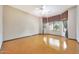 Bedroom features neutral walls, ceiling fan, and a bay window offering natural light at 2229 S 82Nd Ln, Phoenix, AZ 85043