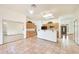 Bright kitchen with tile floors, skylights, wood cabinets and views to front entry at 2229 S 82Nd Ln, Phoenix, AZ 85043