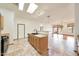 Open kitchen design with breakfast bar and views into the living and dining areas at 2229 S 82Nd Ln, Phoenix, AZ 85043